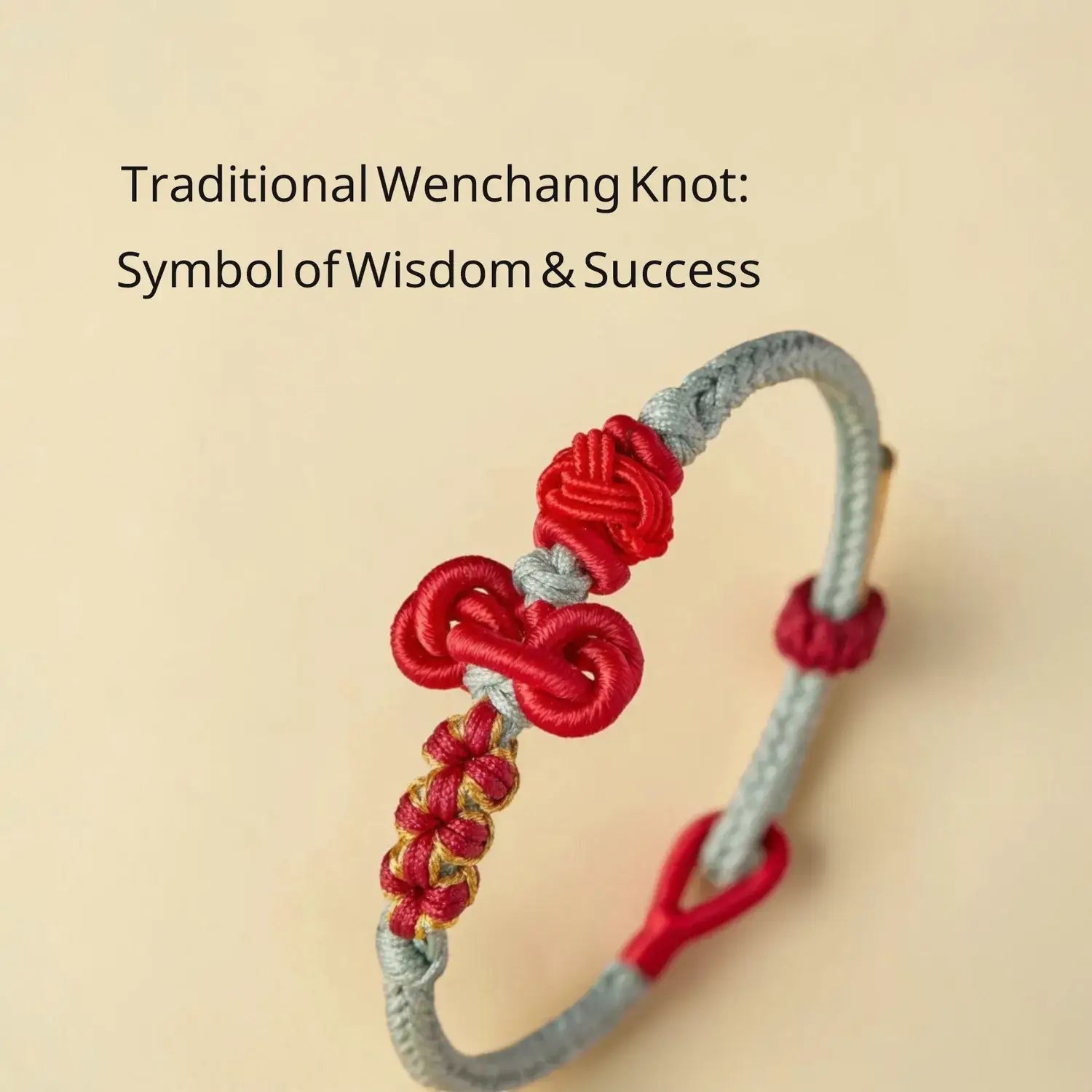 Traditional Wenchang knot bracelet with red and gray strings on a beige background